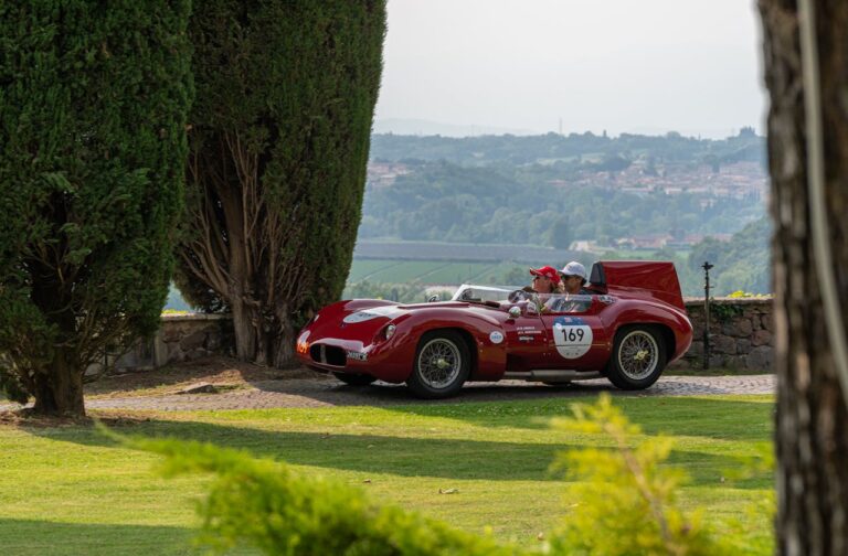 Image of a couple driving a special car in Italy