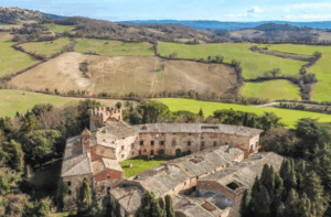 Image of a castle in Tuscany with countryside in the back