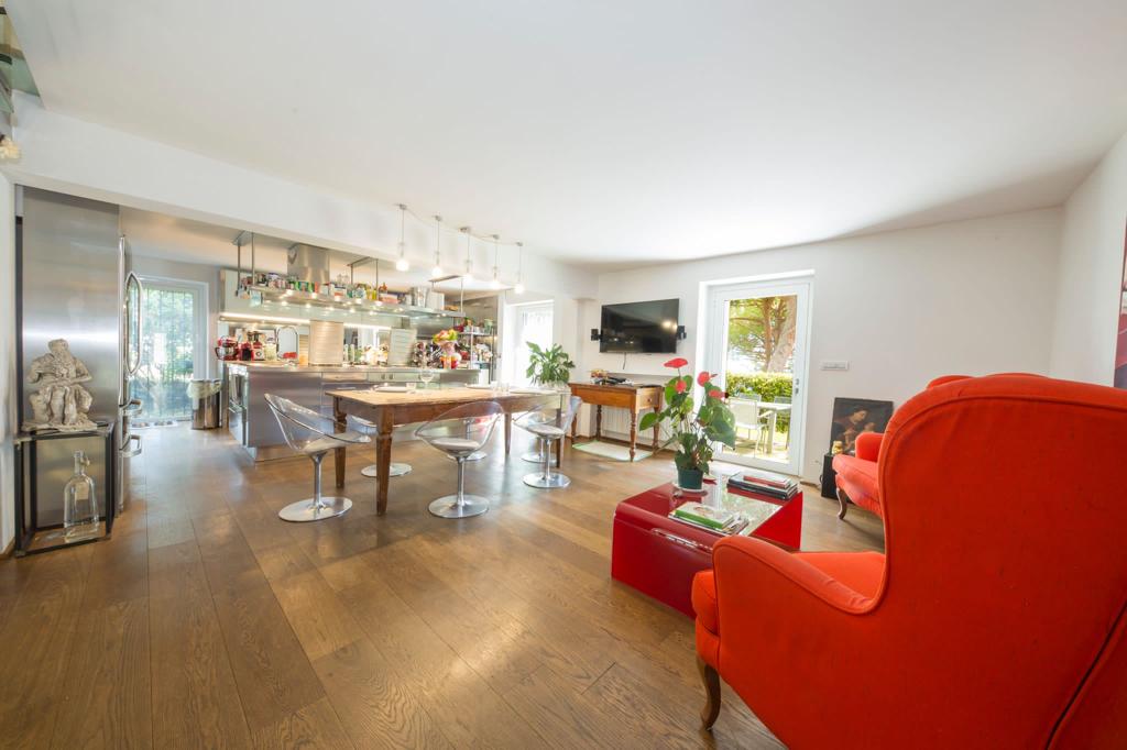 Image of the kitchen room with chairs and sofa chairs in Italian villa