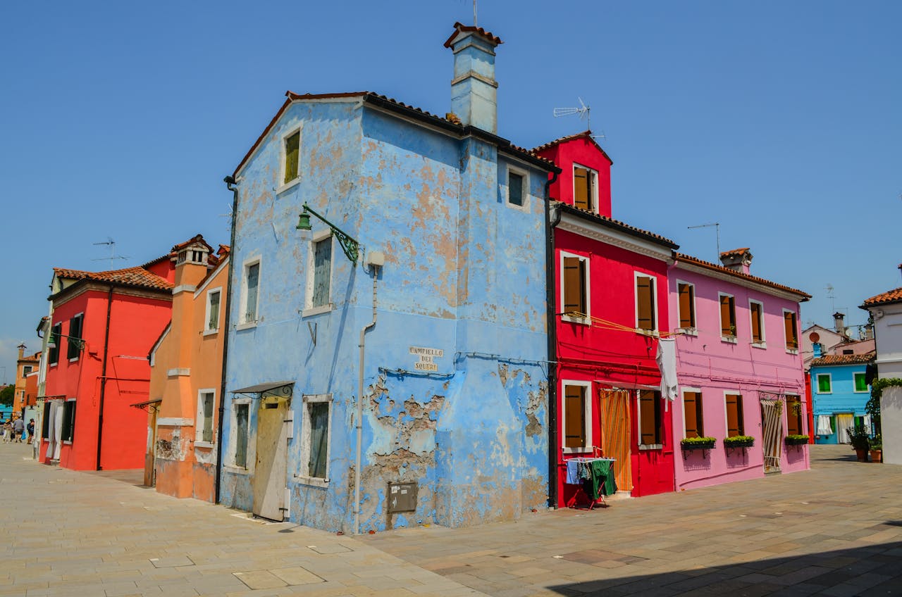 View of a blue house that needs restoration in Italy