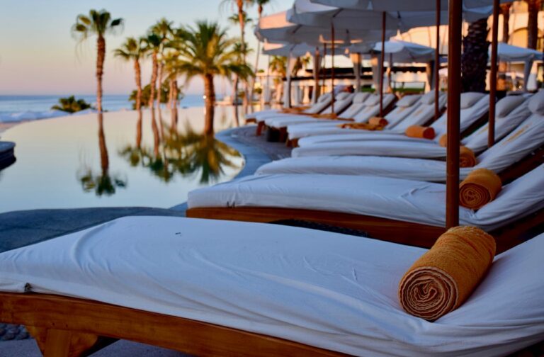 Image of lounge chairs next to a pool