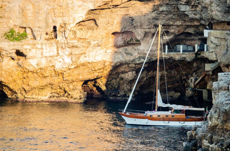 Image of Italian coastline with historical boat