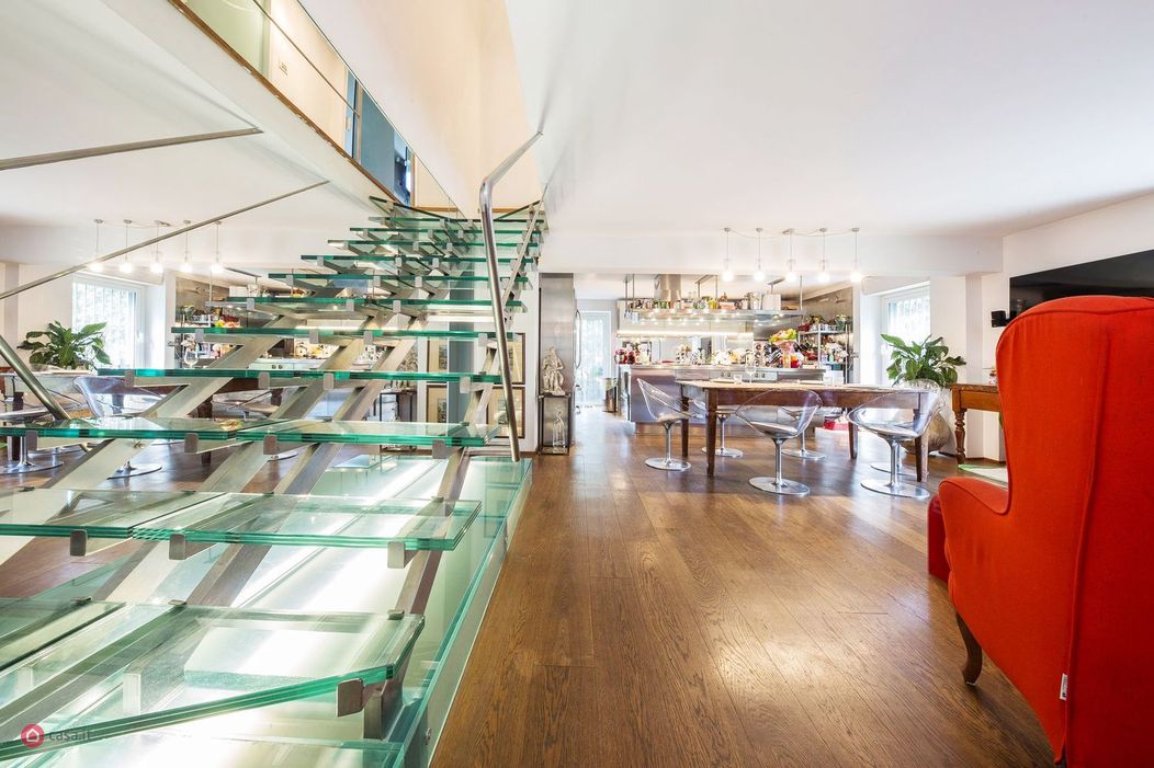 Image of staircase taking to the top floor of an Italian villa